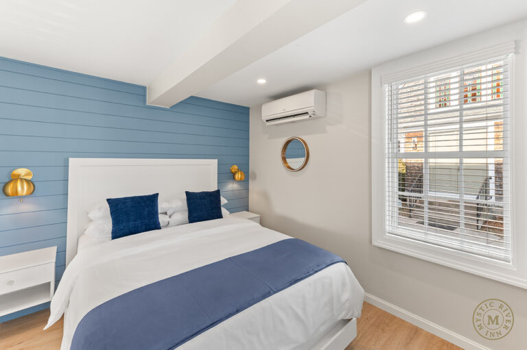 River Side Suite bedroom area at Mystic River Inn.